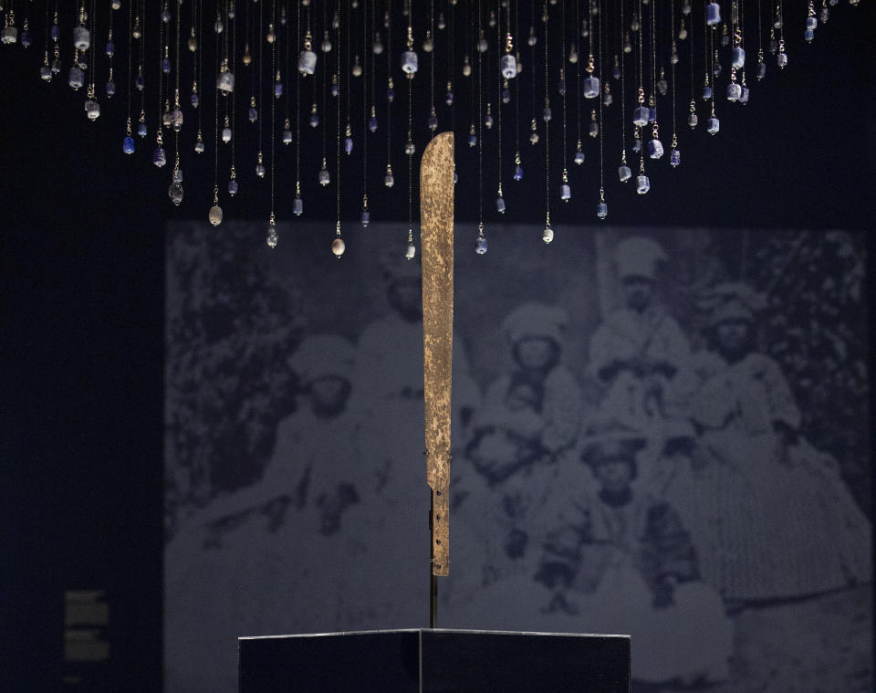 FILE - A machete used for cutting sugar cane is displayed at the Slavery exhibition Rijksmuseum in Amsterdam, Netherlands in this May 17, 2021 file photo. A landmark exhibition on slavery in the Dutch colonial era that was first staged at Amsterdam's Rijksmuseum is going on display at the United Nations in New York Feb. 27-March 30. (AP Photo/Peter Dejong, File)