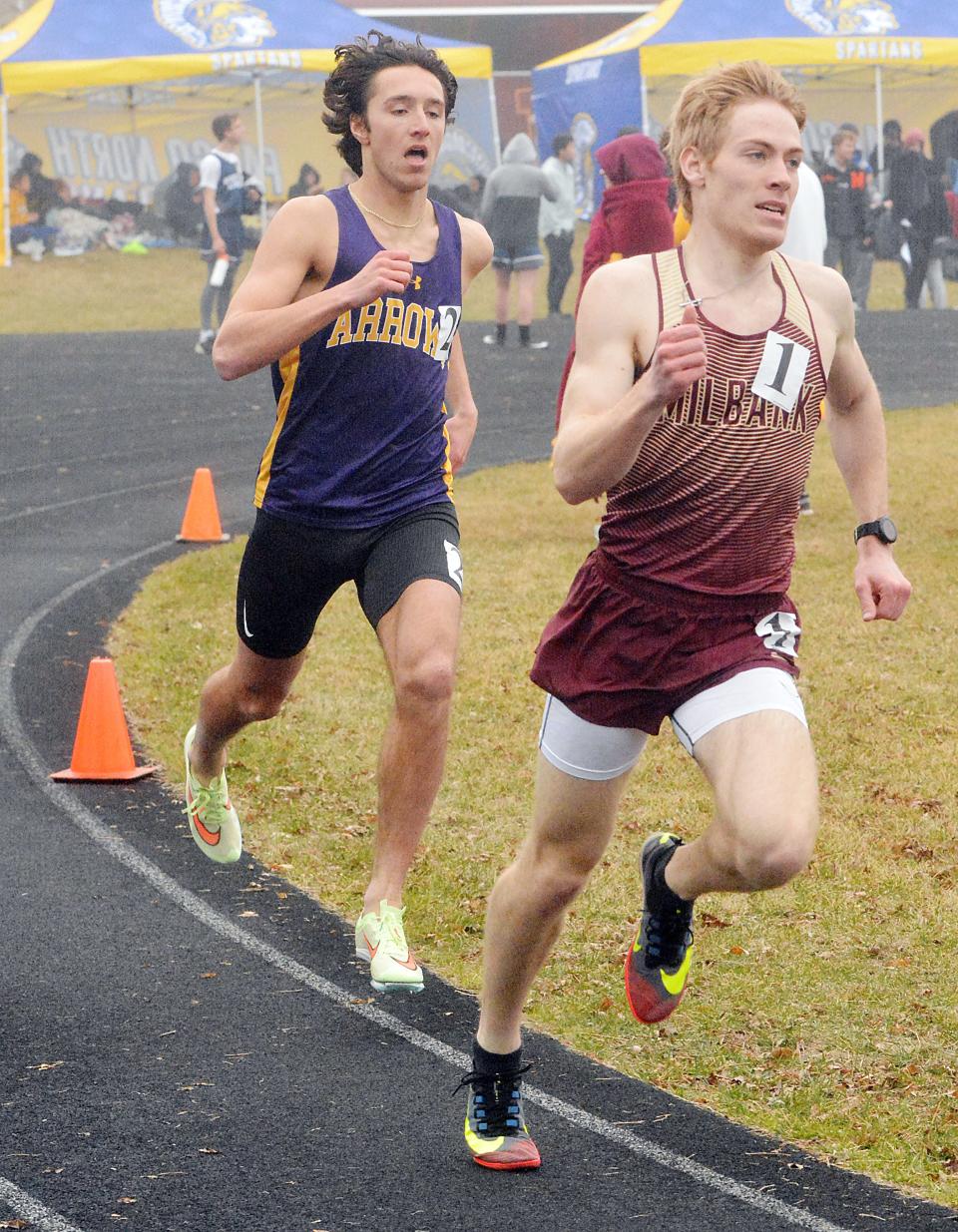 Watertown's Jaxon Fiechtner (left) chases after Milbank's Nick Batchelor during the Class AA boys' 800-meter run  in the 59th Watoma Relays track and field meet on Friday, April 22, 2022 at Allen Mitchell Field.