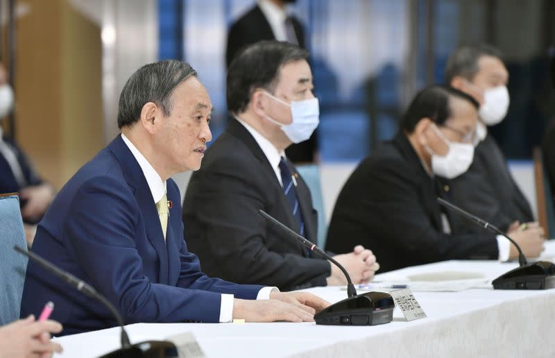 Japan's Prime Minister Yoshihide Suga attends a cabinet meeting at his official residence in Tokyo