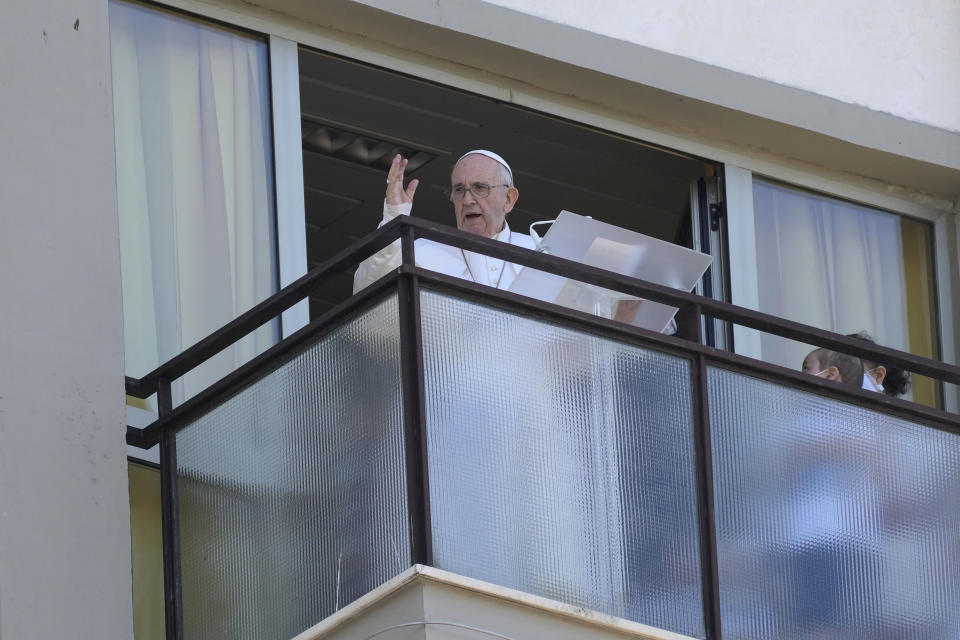 FILE - In this July 11, 2021 file photo, Pope Francis appears on a balcony of the Agostino Gemelli Polyclinic in Rome, where he is recovering from intestinal surgery, for the traditional Sunday blessing and Angelus prayer. Francis is opening his first foreign trip on Sunday, Sept. 12, 2021 since undergoing major intestinal surgery in July, embarking on an intense, four-day, two-nation trip to Hungary and Slovakia that he has admitted might be overdoing it (AP Photo/Gregorio Borgia, file)