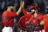 Boston Red Sox's Connor Wong, right, celebrates with Marwin Gonzalez (12) after defeating the New York Yankees during a baseball game, Saturday, June 26, 2021, in Boston. (AP Photo/Michael Dwyer)