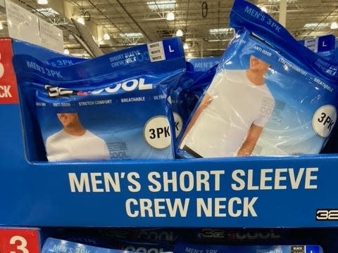 bags of tshirts on the shelves at costco