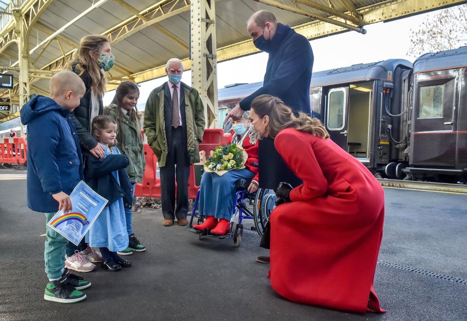 Britain's Prince William, Duke of Cambridge and Britain's Catherine, Duchess of Cambridge chat with Jasmine Warner, 5, (3rd L), who's brother Otto, 8, (L), has today come out of cancer treatment, with sister Poppy, 10, (4th L), and mother Georgie (2nd L), as they arrive at Bath Spa station in Bath, in south west England, for a visit to Cleve Court Care Home to pay tribute to the efforts of care home staff throughout the COVID-19 pandemic, on December 8, 2020, on the final day of engagements on their tour of the UK. - During their trip, their Royal Highnesses hope to pay tribute to individuals, organisations and initiatives across the country that have gone above and beyond to support their local communities this year. (Photo by Ben Birchall / POOL / AFP) (Photo by BEN BIRCHALL/POOL/AFP via Getty Images)