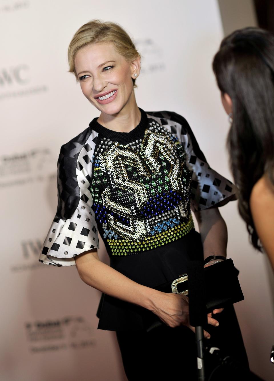 DUBAI, UNITED ARAB EMIRATES - DECEMBER 10: Actress Cate Blanchett speaks to the media as she attends the Dubai International Film Festival and IWC Schaffhausen Filmmaker Award Gala Dinner and Ceremony at the One and Only Mirage Hotel on December 10, 2012 in Dubai, United Arab Emirates. (Photo by Gareth Cattermole/Getty Images for DIFF)