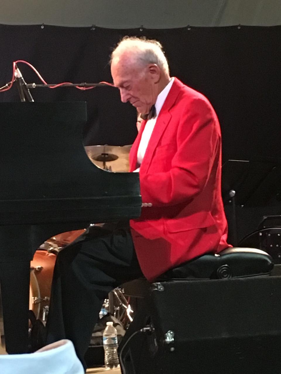 A formally attired Walt Dear performs at the piano at the annual Music in the Mountains festival in Durango, Colorado, in about 2017. Dear was a major sponsor for the that and other musical events in Durango, where he lived during his retirement years.