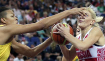 Australia's Elizabeth Cambage jams her finger into the eye of Russia's Natalya Vodopyanova while defending a drive to the basket during a women's bronze medal basketball game at the 2012 Summer Olympics, Saturday, Aug. 11, 2012, in London. (AP Photo/Charles Krupa)