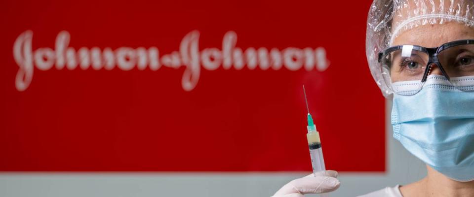 Johnson and Johnson logo with medical worker