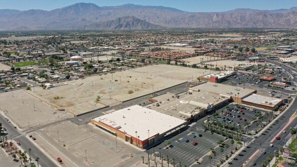 The Indio Grand Marketplace, lower right, and the vacant lots of the former John Nobles neighborhood can be seen in this aerial photo above Indio, Calif., March 2022. The Kyriakos Christian Center can be seen in the upper left corner of the dirt plot.