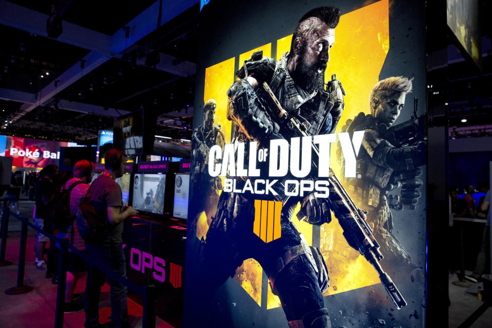 Attendees play the Activision Blizzard Inc. Call Of Duty: Black Ops 4 video game at the company's booth during the E3 Electronic Entertainment Expo in Los Angeles, California, U.S., on Tuesday, June 12, 2018. For three days, leading-edge companies, groundbreaking new technologies and never-before-seen products is showcased at E3. Photographer: Troy Harvey/Bloomberg via Getty Images