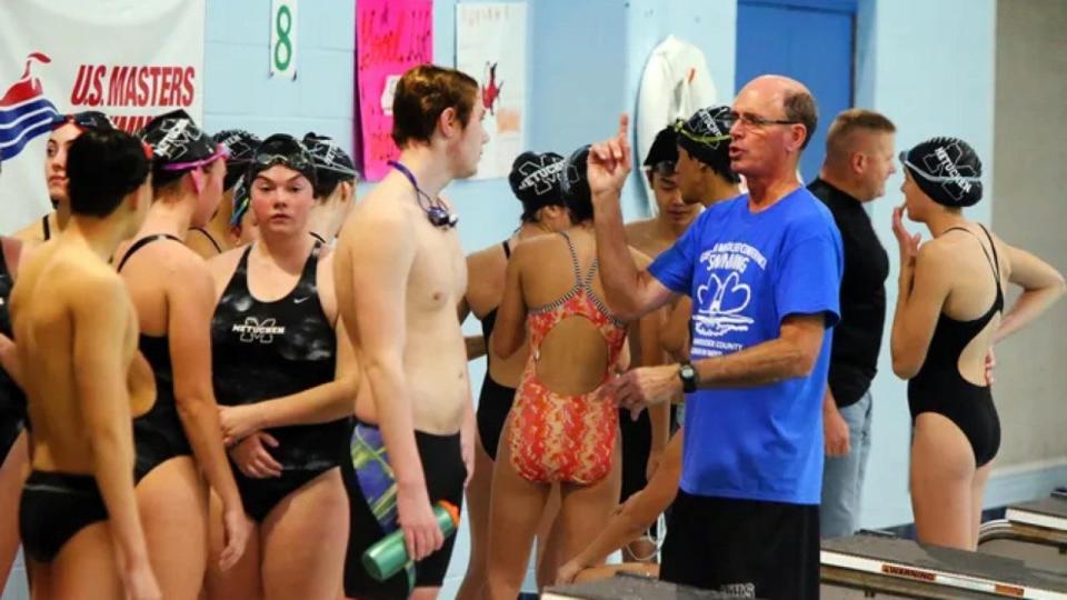 Metuchen coach Jim Thomas talks with his swimmers during a previous “Practice for a Purpose” event.