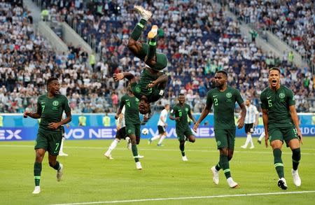 Soccer Football - World Cup - Group D - Nigeria vs Argentina - Saint Petersburg Stadium, Saint Petersburg, Russia - June 26, 2018 Nigeria's Victor Moses celebrates scoring their first goal with Ahmed Musa, Brian Idowu and William Troost-Ekong REUTERS/Toru Hanai