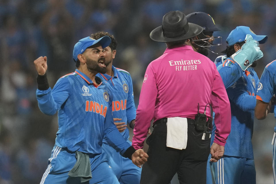 India's Virat Kohli appeals for the run out of New Zealand's captain Kane Williamson, which was later called off by third umpire during the ICC Men's Cricket World Cup first semifinal match between India and New Zealand in Mumbai, India, Wednesday, Nov. 15, 2023. (AP Photo/Rafiq Maqbool)