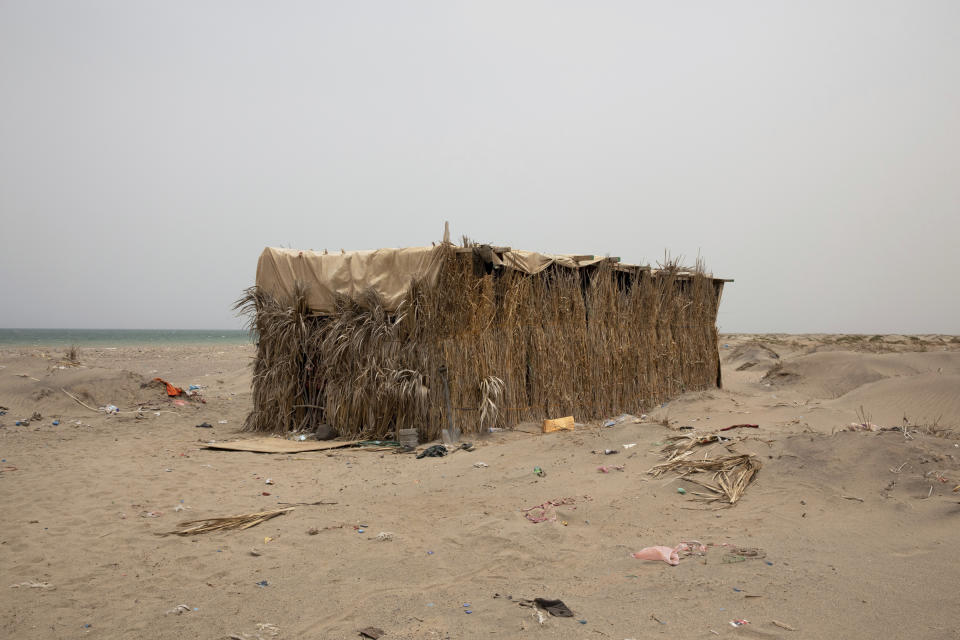 This July 25, 2019 photo, shows a hosh owned by smugglers where migrants stay after their arrival, in Lahj, Yemen. Nearly every migrant who lands in the nearby village of Ras al-Ara is imprisoned in hidden compounds while their families are shaken down for money. (AP Photo/Nariman El-Mofty)