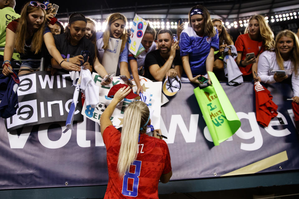 United States' Julie Ertz signs autographs for fans after the team's international friendly soccer match against Portugal on Thursday, Aug. 29, 2019, in Philadelphia. The United States won 4-0. (AP Photo/Matt Slocum)