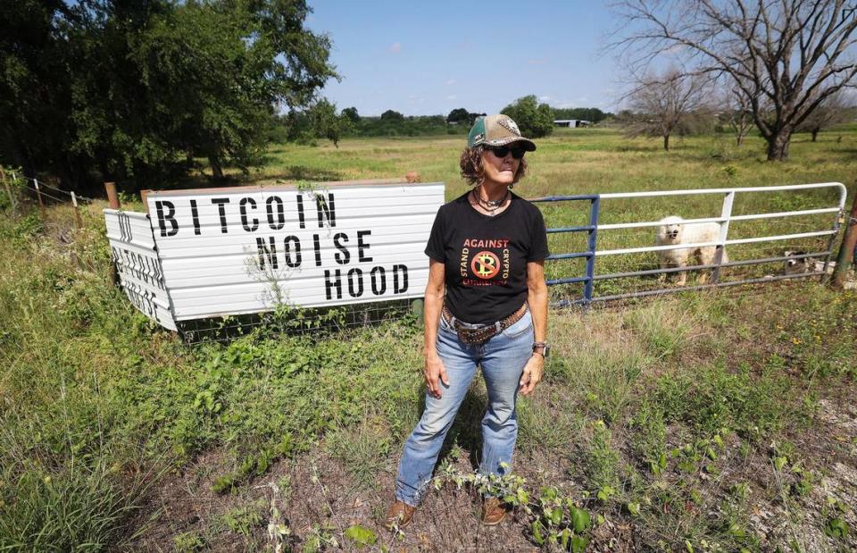 Granary resident Cheryl Shadden stands at the edge of her property that faces a bitcoin mining facility on Wednesday, May 29, 2024. “No one in their right mind would live in this area. It’s miserable,” said Shadden about the near constant noise generated from the facility.