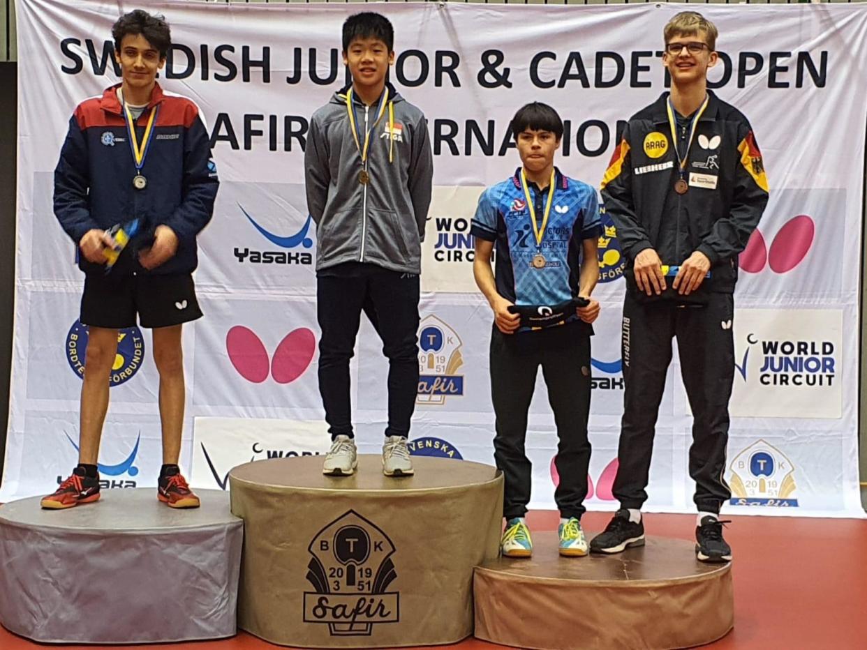 Singapore youth paddler Izaac Quek (second from left) stands on the top podium after winning the cadet boys' singles title at the Swedish Cadet and Junior Open. (PHOTO: STTA)