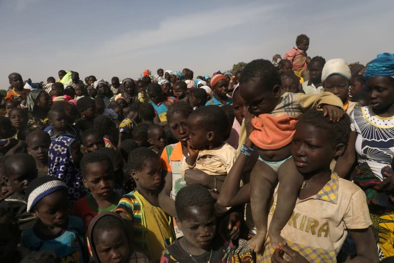 Displaced children wait for help at a village in Dablo area, Burkina Faso