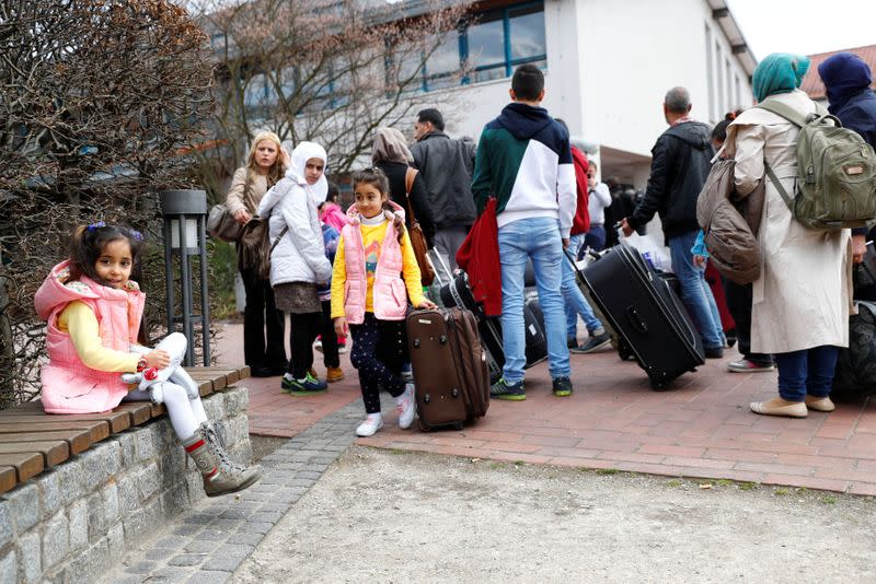 FILE PHOTO: Syrian refugees arrive at the camp for refugees and migrants in Friedland