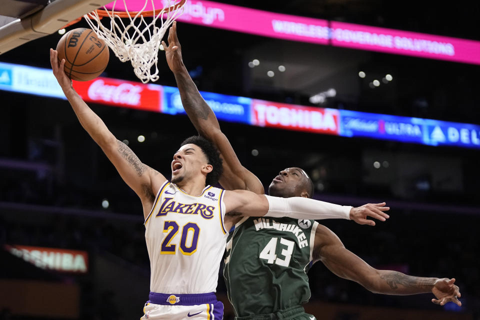 Los Angeles Lakers guard Scotty Pippen Jr., left, shoots as Milwaukee Bucks forward Thanasis Antetokounmpo defends during the second half of an NBA preseason basketball game Sunday, Oct. 15, 2023, in Los Angeles. (AP Photo/Mark J. Terrill)