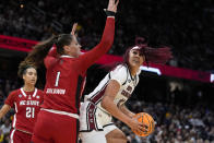 South Carolina center Kamilla Cardoso drives around North Carolina State center River Baldwin (1) during the first half of a Final Four college basketball game in the women's NCAA Tournament, Friday, April 5, 2024, in Cleveland. (AP Photo/Morry Gash)