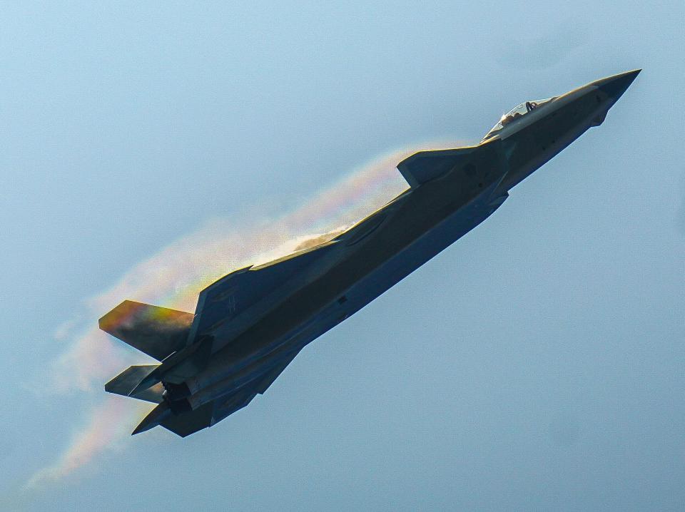 A J-20 stealth fighter jet performs aerobatics during the 13th China International Aviation and Aerospace Exhibition, or Airshow China 2021, in Zhuhai, south China's Guangdong Province, Sept. 28, 2021.