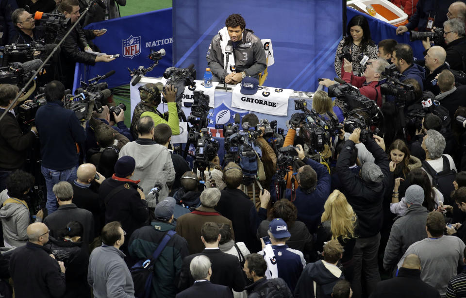 Seattle Seahawks' Russell Wilson answers a question during media day for the NFL Super Bowl XLVIII football game Tuesday, Jan. 28, 2014, in Newark, N.J. (AP Photo/Charlie Riedel)