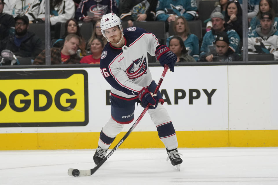 Columbus Blue Jackets center Jack Roslovic (96) shoots the puck against the San Jose Sharks during the second period of an NHL hockey game in San Jose, Calif., Saturday, Feb. 17, 2024. (AP Photo/Jeff Chiu)