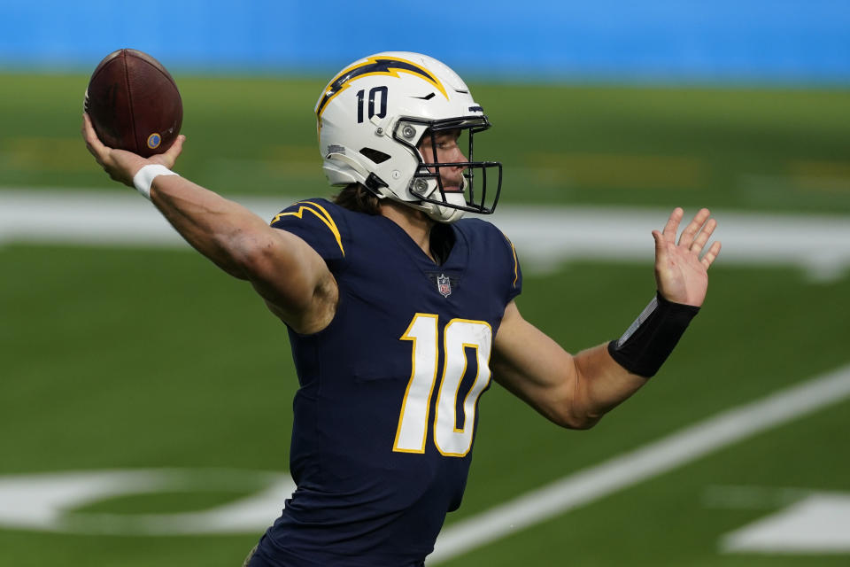 Los Angeles Chargers quarterback Justin Herbert throws a pass during the first half of an NFL football game against the Las Vegas Raiders, Sunday, Nov. 8, 2020, in Inglewood, Calif. (AP Photo/Ashley Landis)