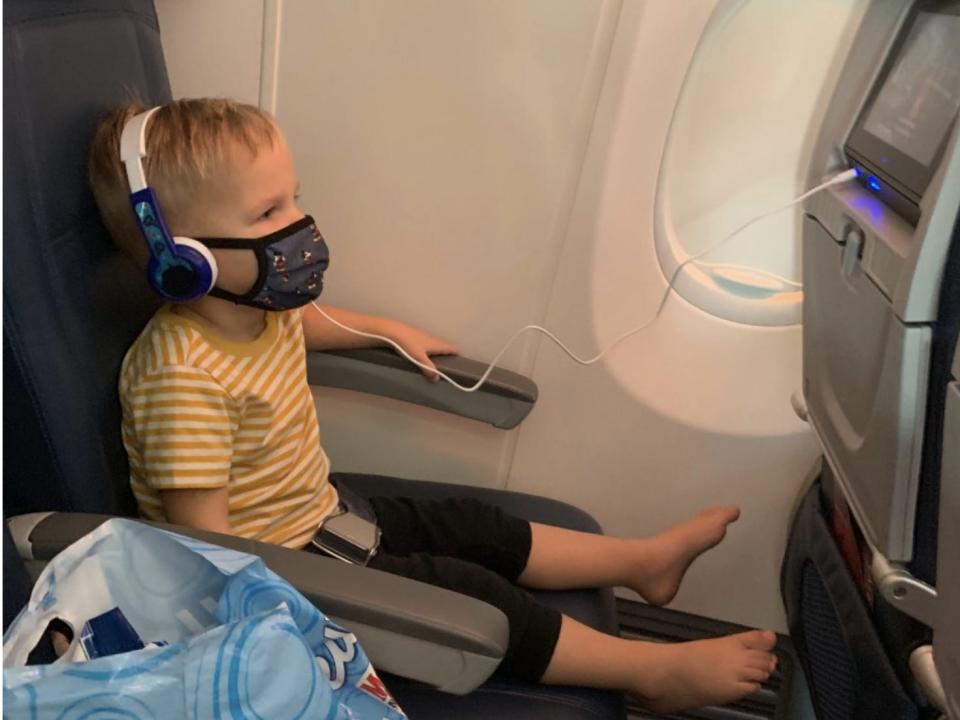 The author's son watching Delta's family friendly in flight entertainment on the plane