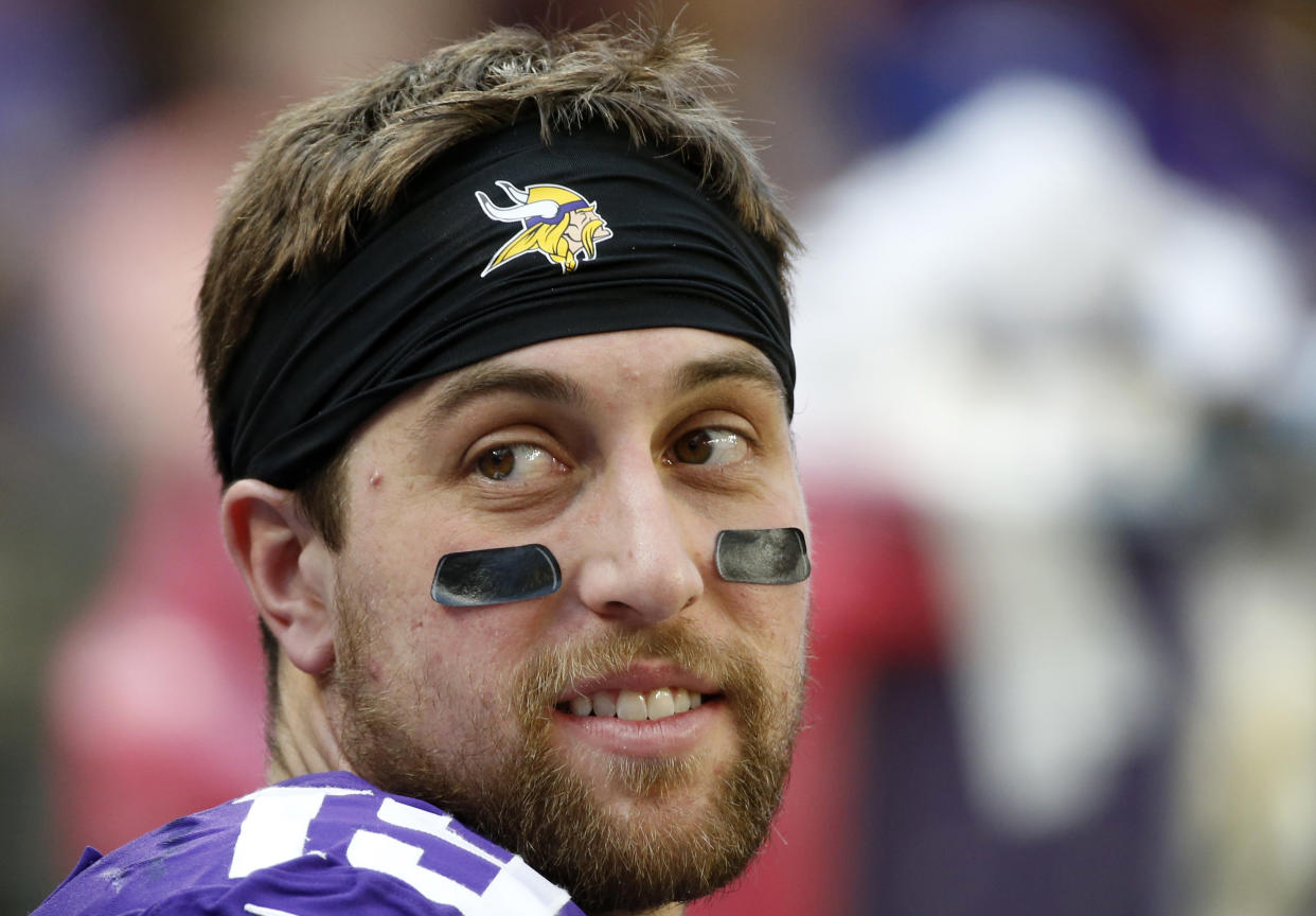 Adam Thielen was upset when officials took him out of the game to be checked for a concussion. (AP)