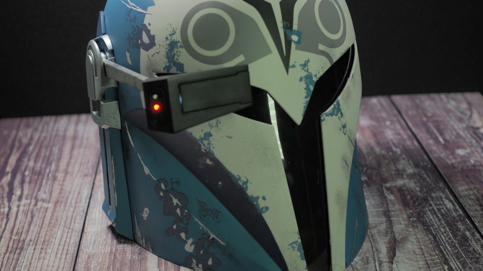 The Black Series Bo-Katan helmet on a wooden surface with the rangefinder down