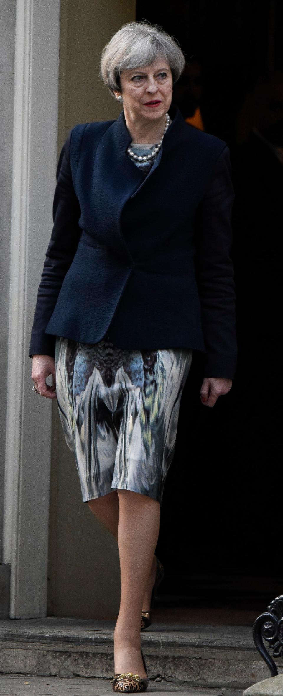 Theresa May's skirt was above the knee when she wasn't sitting down - Credit: Steve Back /Barcroft Media