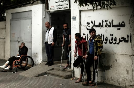 Palestinians wounded in protests against Israeli forces along Gaza's border with Israel await medical check-up at a clinic in Gaza City on April 25, 2018