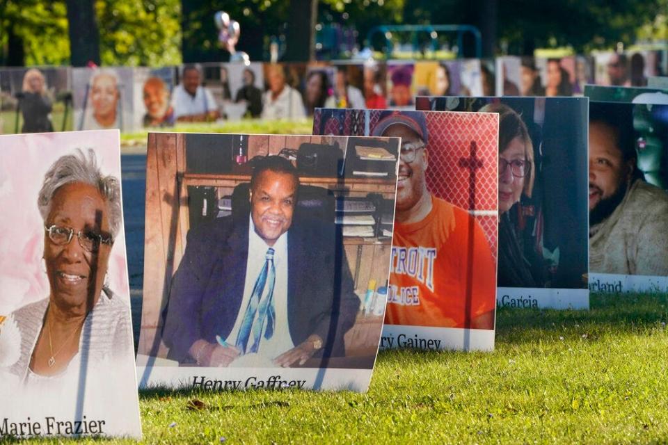 In this Aug. 31, 2020, file photo, some of the nearly 900 large poster-sized photos of Detroit victims of COVID-19 are displayed on Belle Isle in Detroit. The U.S. death toll from the coronavirus topped 200,000 Tuesday, Sept. 22, a figure unimaginable eight months ago when the scourge first reached the world's richest nation with its sparkling laboratories, top-flight scientists and towering stockpiles of medicines and emergency supplies.