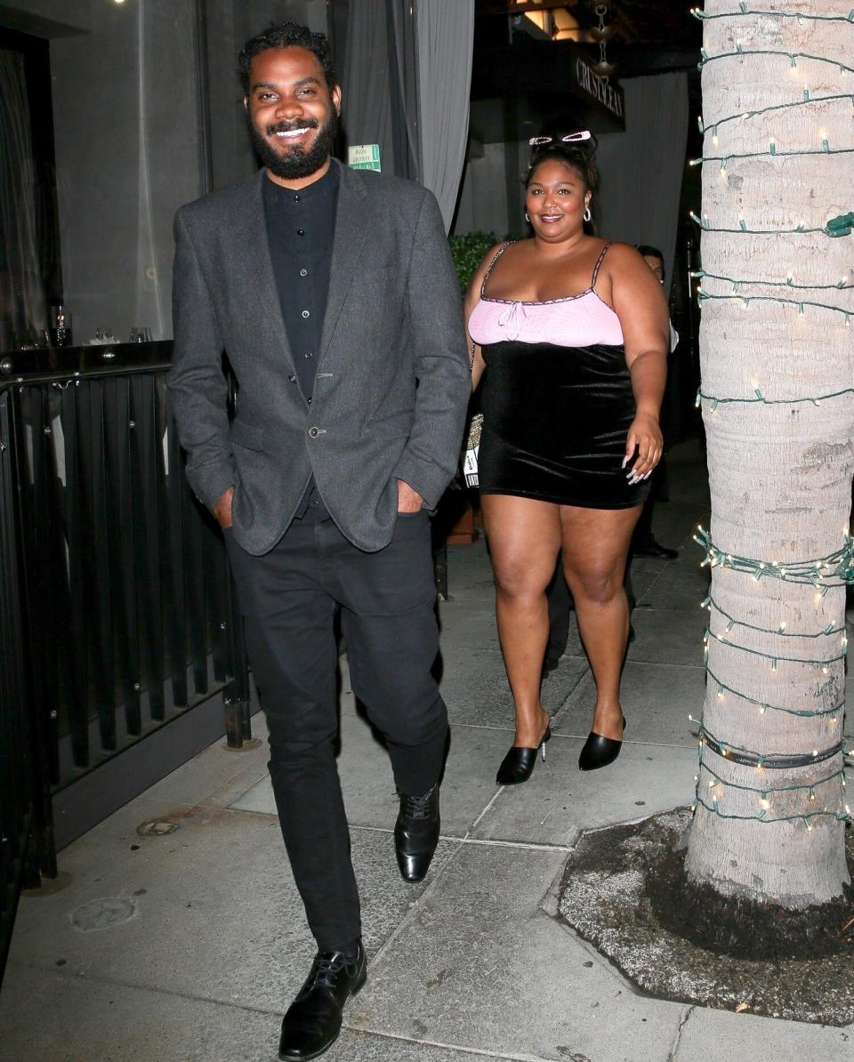 *EXCLUSIVE* - Singer Lizzo looks smitten on a night out with a handsome mystery man at Crustacean in Beverly Hills