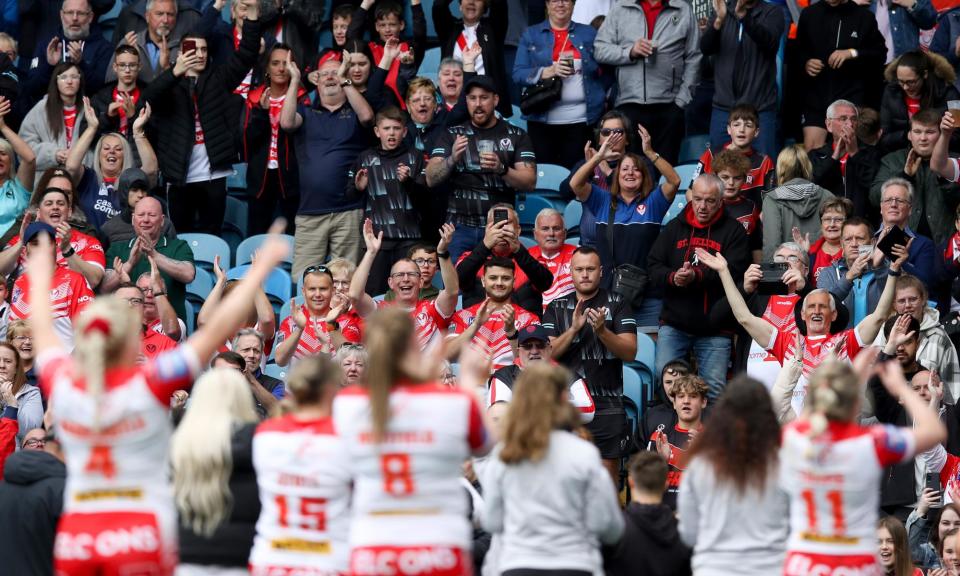 <span>St Helens celebrate with their fans after beating Leeds in the 2022 grand final.</span><span>Photograph: George Wood/Getty Images</span>