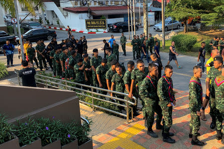 Soldiers line up for their early vote of the upcoming Thai election at a polling station in Pattani province, Thailand, March 17, 2018. REUTERS/Panu Wongcha-um