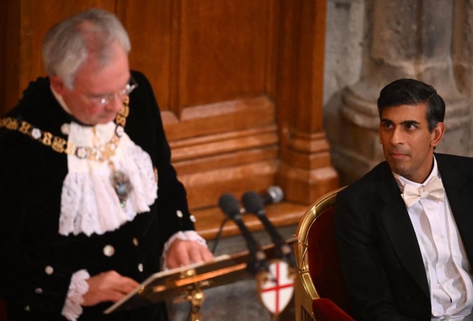 Rishi Sunak listens to Nicholas Lyons   at the Lord Mayor’s Banquet in November  (AFP via Getty Images)