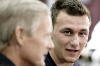 Texas A&M quarterback Johnny Manziel talks to members of the media during pro day for NFL football representatives in College Station, Texas, Thursday, March 27, 2014. (AP Photo/Patric Schneider)