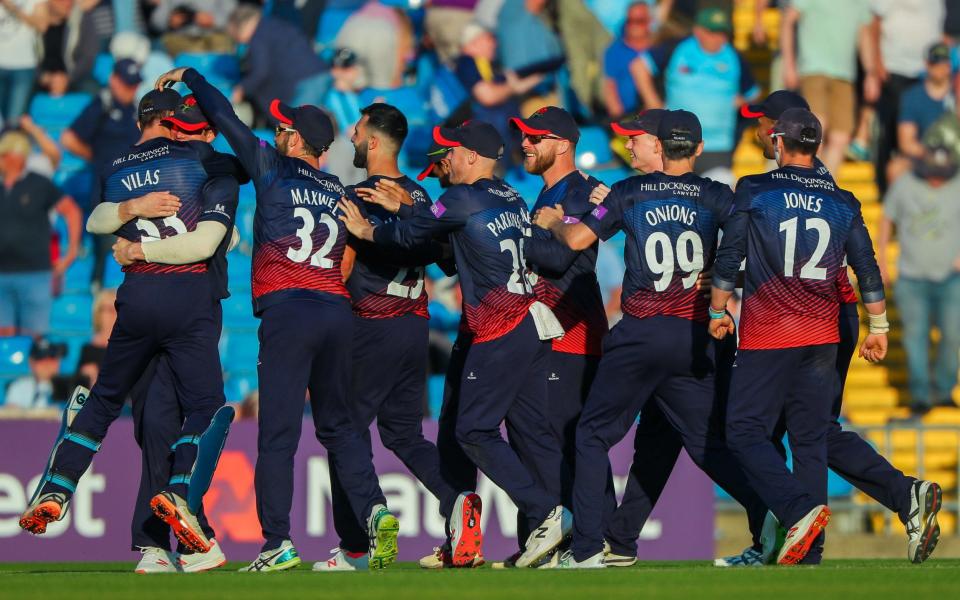 The Lancashire players celebrate their one-run victory at Headingley - REX