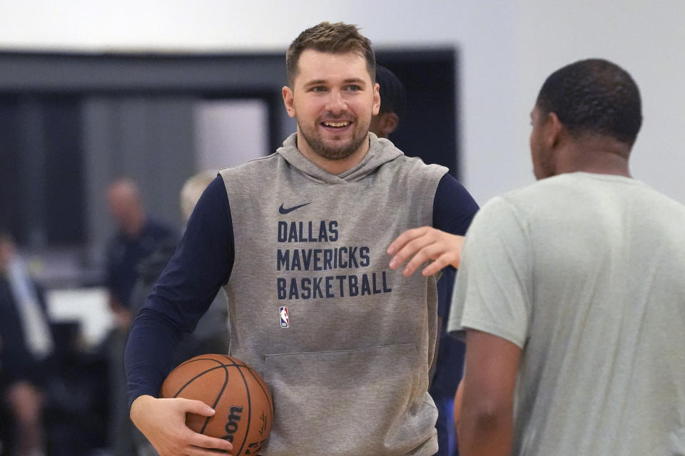 Dallas Mavericks guard Luka Doncic smiles on the court during an NBA basketball training camp in Dallas, Thursday, Sept. 28, 2023. (AP Photo/LM Otero)