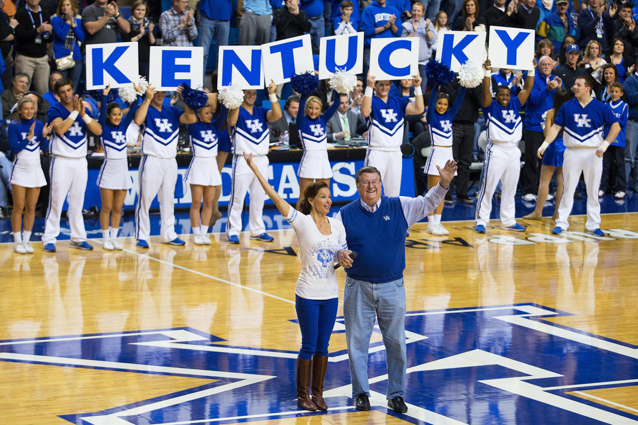 Legendary Kentucky coach Joe B Hall, right, with Kentucky alumnae Ashley Judd in 2013. (Jonathan Palmer/Lexington Herald-Leader/Tribune News Service via Getty Images)