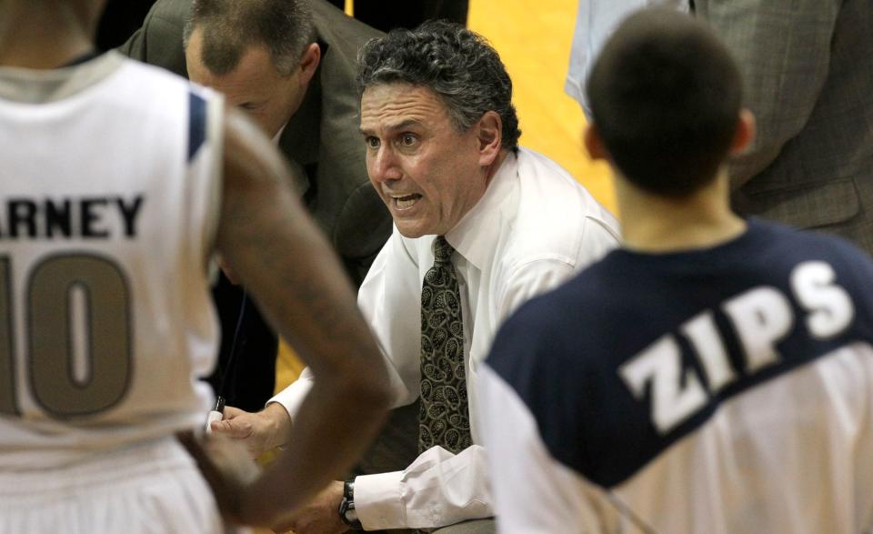 Akron men's basketball coach Keith Dambrot talks to his team during a timeout in the Zips' 68-56 victory over Central Michigan, Feb. 5, 2013.