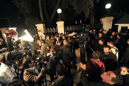Greek and foreign media wait outside the presidental palace in Athens. European leaders have become increasingly frustrated at the political impasse in Athens at a time when they want to press ahead with hard-won agreements reached in late October on tackling the eurozone debt crisis