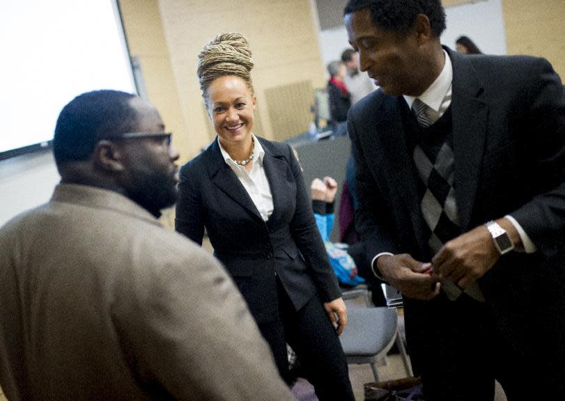 Rachel Dolezal, Spokane's newly elected NAACP President, smiles as she meets with Joseph M. King of King's Consulting, left, and Dr. Scott Finnie, director and senior professor of EWU's Africana Education Program before the start of a Black Lives Matter Teach-In on Public Safety and Criminal Justice at EWU in Cheney, Wash. (Tyler Tjomsland/The Spokesman-Review)