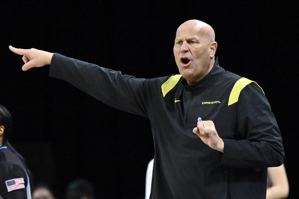 Oregon coach Kelly Graves calls out to the team during the second half of an NCAA college basketball game against Washington in the first round of the Pac-12 women's tournament Wednesday, March 1, 2023, in Las Vegas. (AP Photo/David Becker)