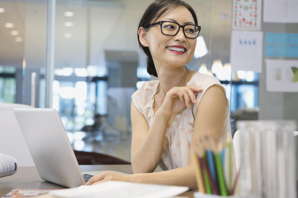 Businesswoman looking away at office desk