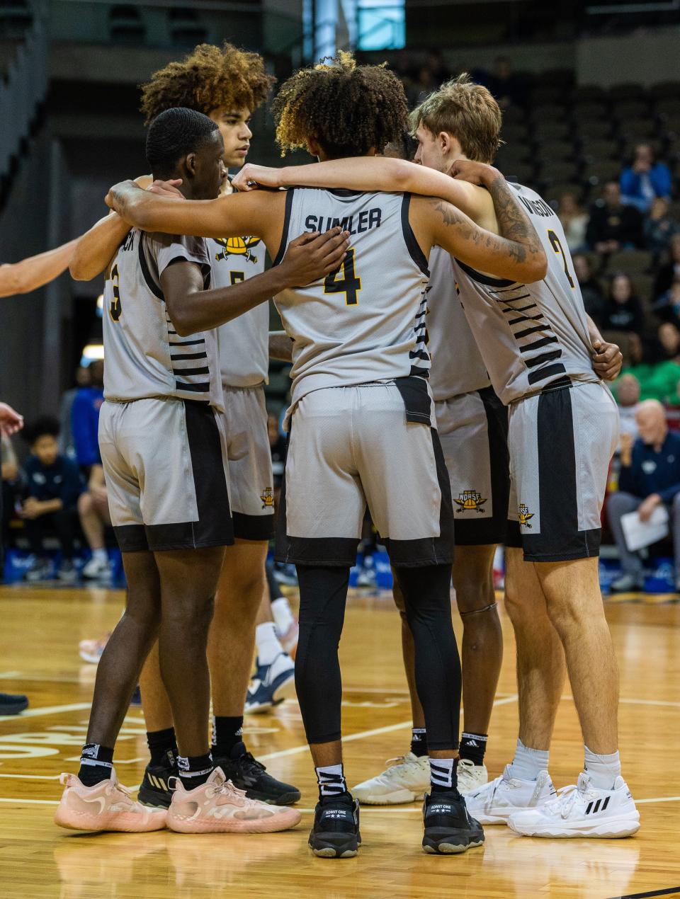 Norse players huddle together in a timeout during NKU's 78-76 overtime win over Detroit Mercy Jan. 8, 2023.