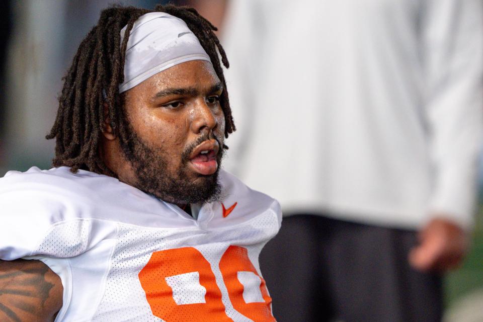 Iman Oates (99) stretches out during an Oklahoma State football practice in Stillwater, Okla., on Saturday, Aug. 3, 2024.