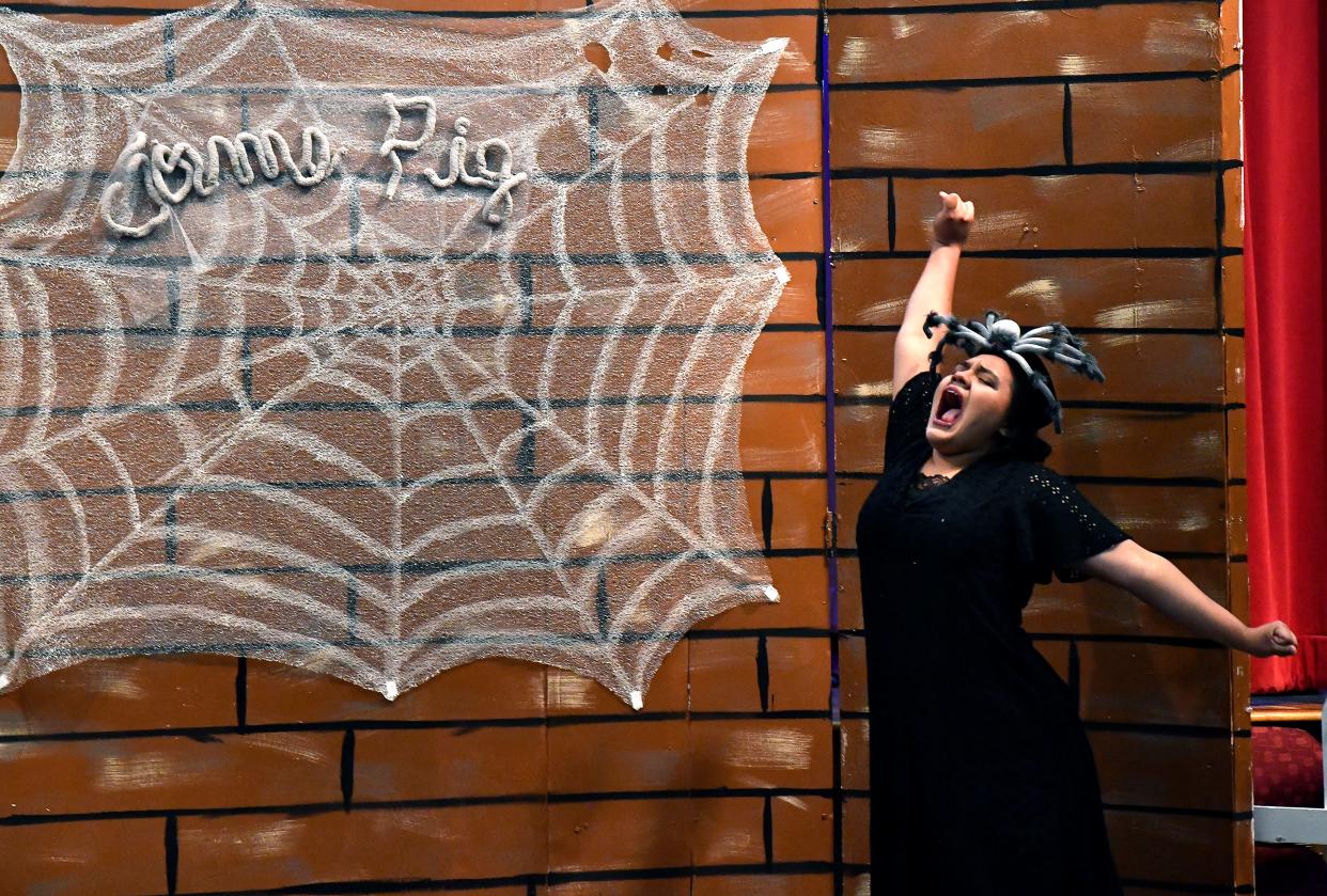 Portraying the spider Charlotte, Victoria Picon stretches during Tuesday's Young Audiences performance of "Charlotte's Web" at the Abilene Public LIbrary's Main Branch by McMurry University students.